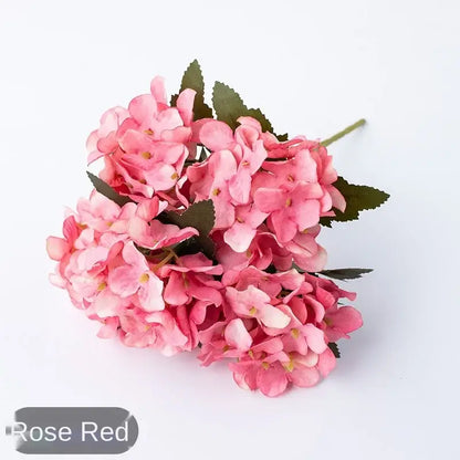 A cluster of artificial rose red hydrangea flowers with green leaves and stems for decorbites hydrangea branch decor