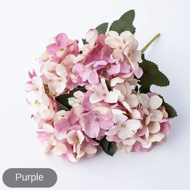 A decorbites hydrangea branch featuring realistic pink and white artificial petals with dark green leaves for decorbites hydrangea branch decor