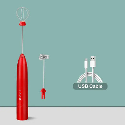 Red handheld electric milk frother with silver whisk attachment and red base for rechargeable electric milk frother mixer