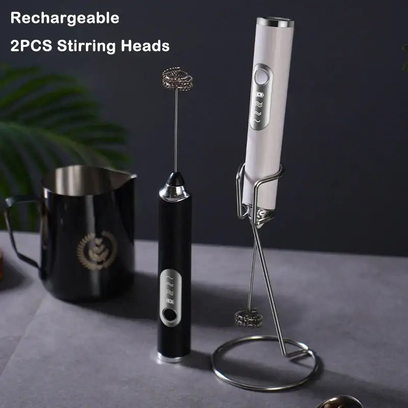 Rechargeable black and silver electric milk frother with stainless steel whisk attachment for kitchen use