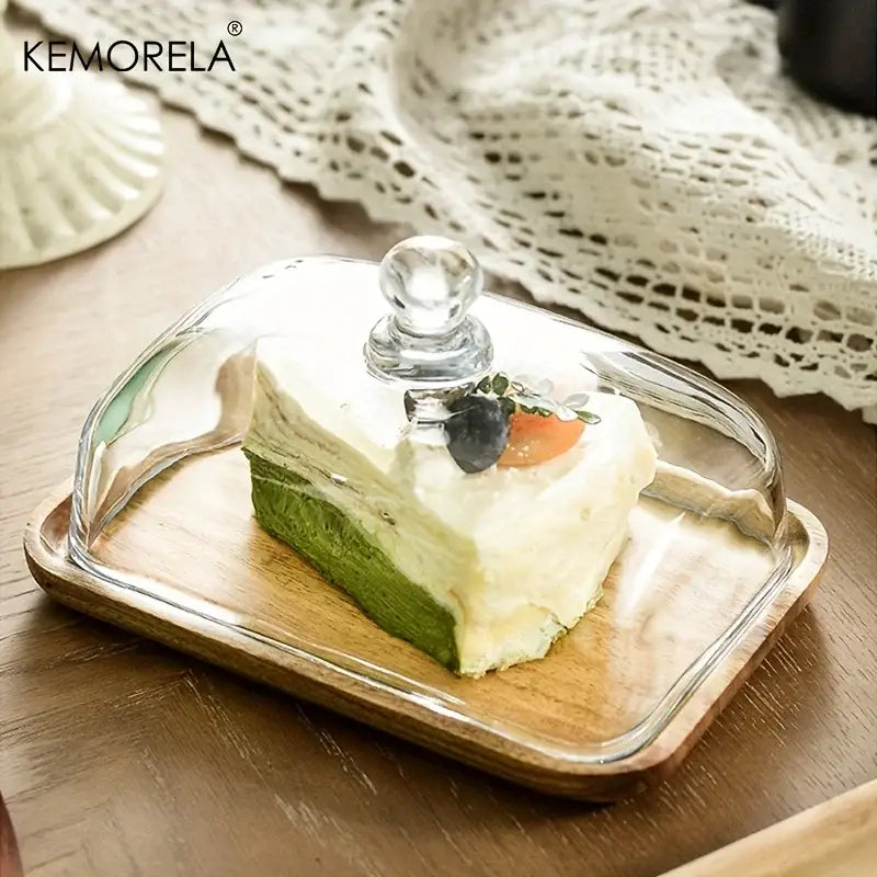 Clear glass cake dome with rounded knob handle on rectangular cake dessert wood plate for decorbites cake dessert use