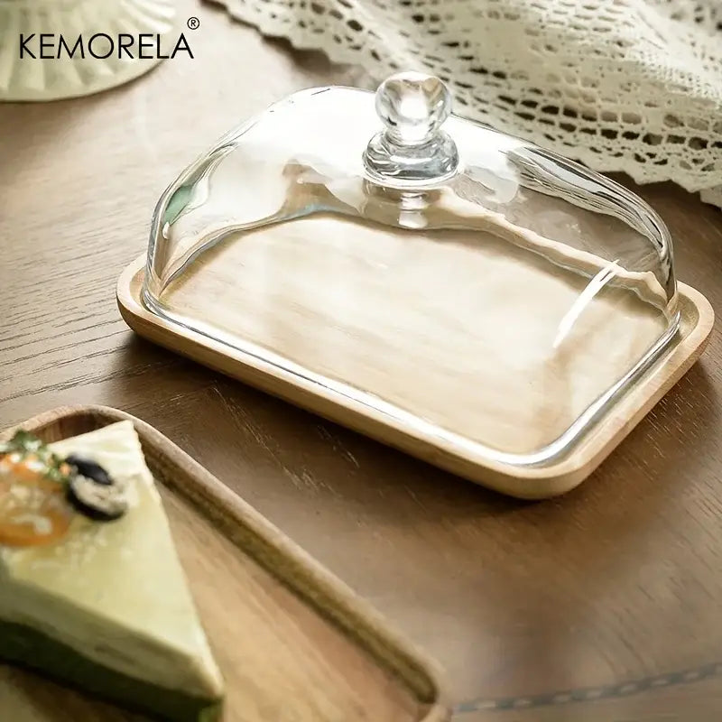 Clear glass cloche with rounded knob lid on light wood base dessert wood plate for decorbites cake dessert serving