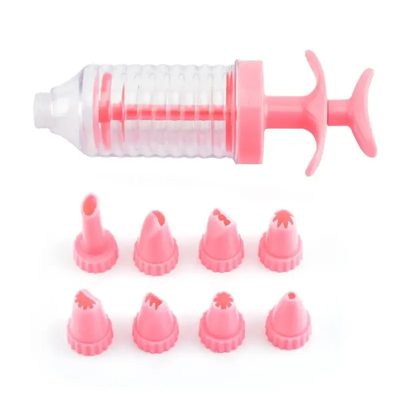 Pink plastic cake decorating syringe with matching pink silicone tips for decorbites cookie cream cake press kit