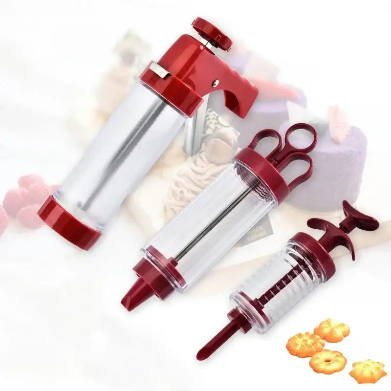 Red and clear plastic cream cake press with various nozzle attachments for decorbites cookie cream decorating kit