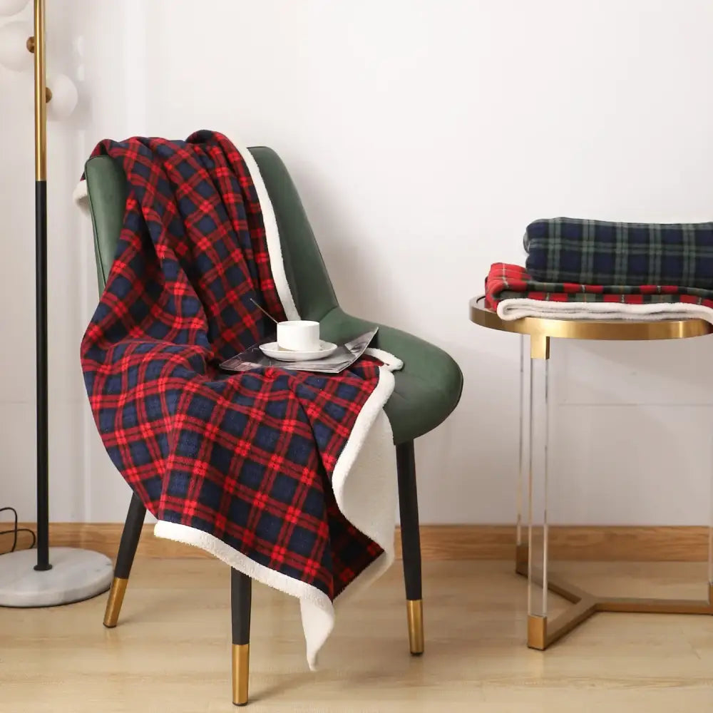 Red and navy plaid bedroom throw with soft white fleece lining made of cozy coral fleece by decorbites