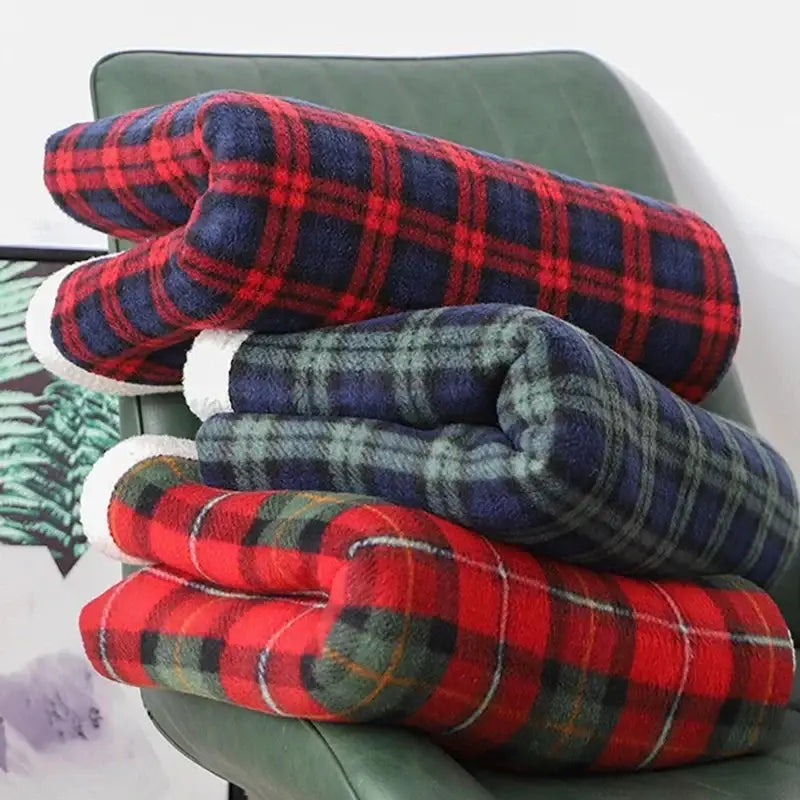 Stacked red and green cozy coral fleece plaid blankets featuring decorbites cozy coral fleece material for bedroom throw