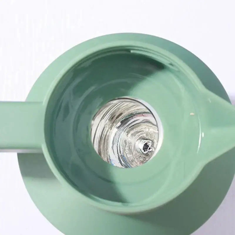 Matte sage green ceramic insulated water thermos kettle with smooth rounded body and integrated handle for kitchen use