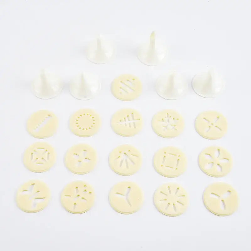 Set of white plastic piping tips with various designs for red and silver decorbites cake cream decorating gun kit