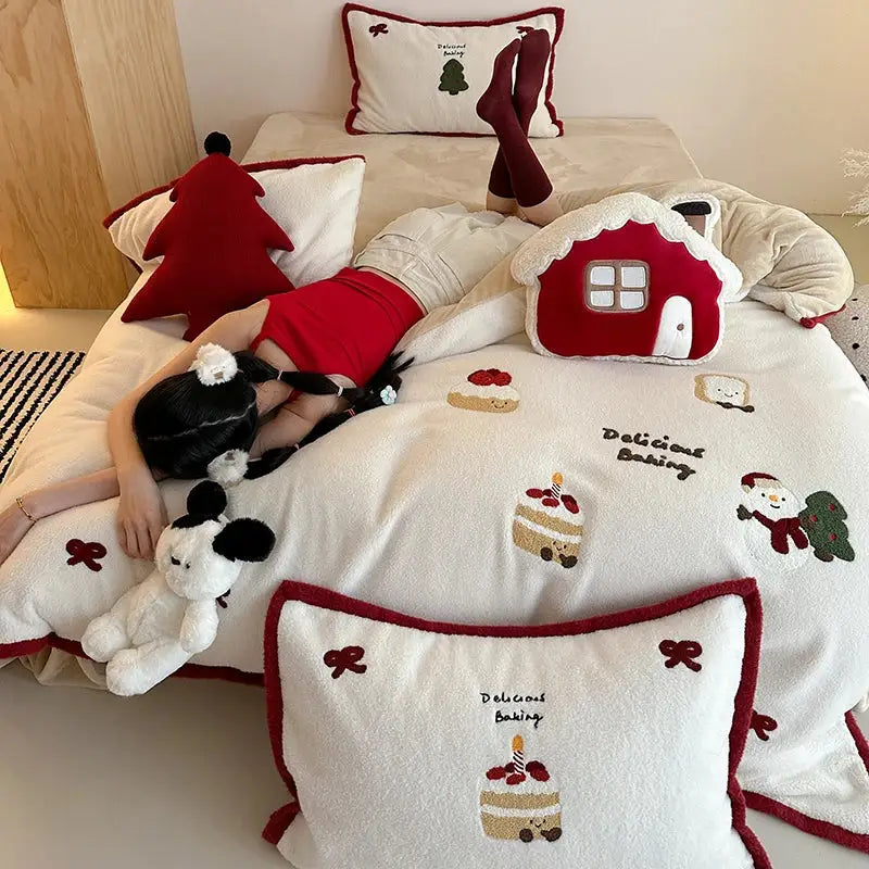 White plush bedding set with red trim featuring cartoon embroidered festive cakes snowman and delicious baking decorbites design