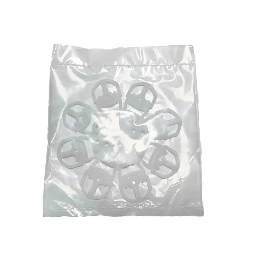 White plastic clip-style fasteners in clear bag for use with red and white espresso machine cleaning brush and kitchen tools