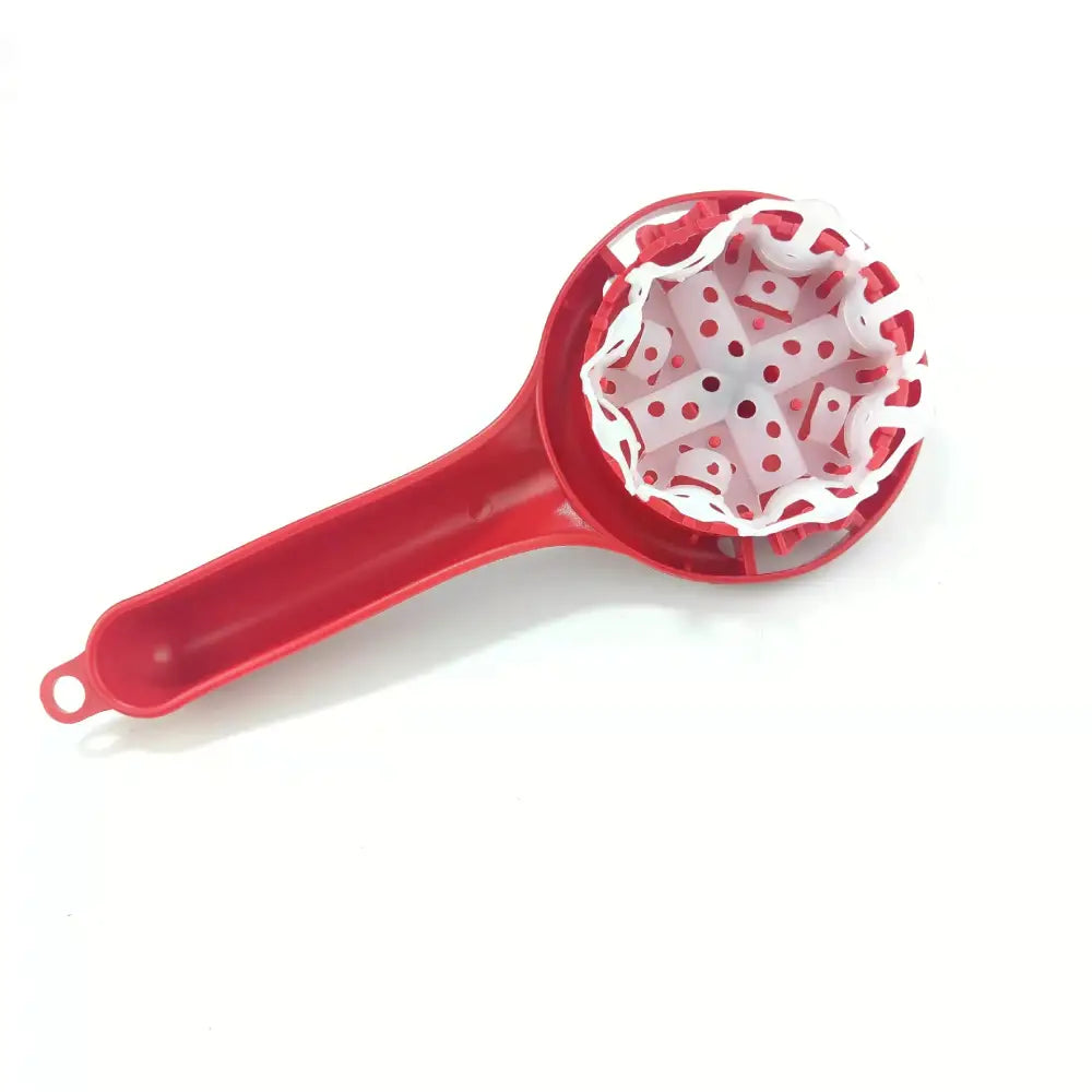 Red plastic fruit corer with white perforated inner mechanism designed as an espresso machine cleaning brush and masher