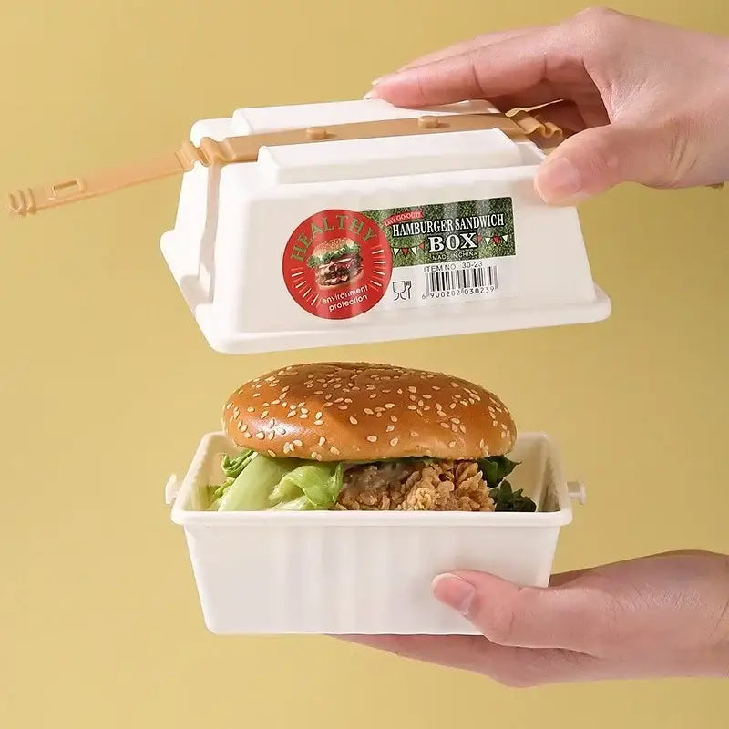 White plastic hamburger bento box set with tan latches and green and red label for kitchen picnic storage