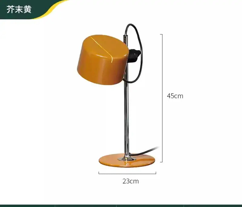 A sleek chrome coupe table lamp with a glossy mustard yellow shade and base on a slender chrome stand for decorbites chrome coupe