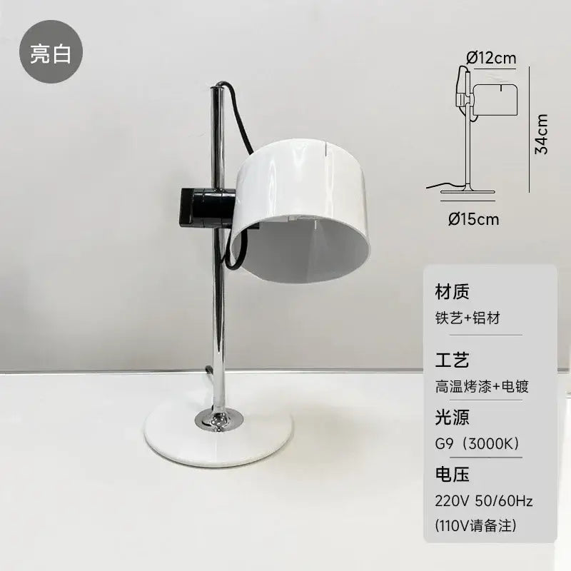 A sleek white decorbites chrome coupe table lamp with an adjustable chrome arm for bedroom decor lighting