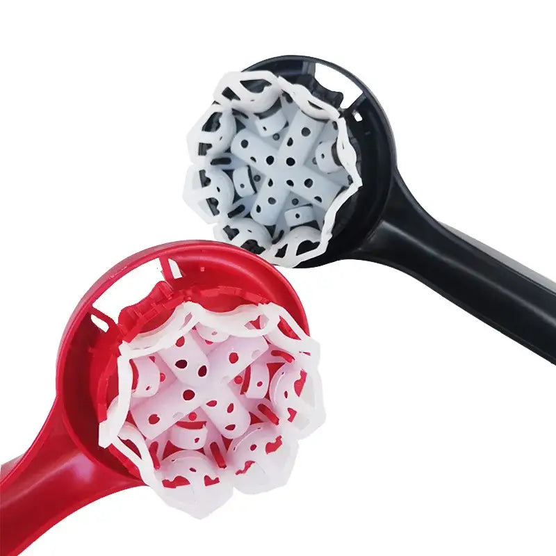 Red and black plastic espresso machine brush cleaner with white perforated silicone attachments for decorbites espresso machine
