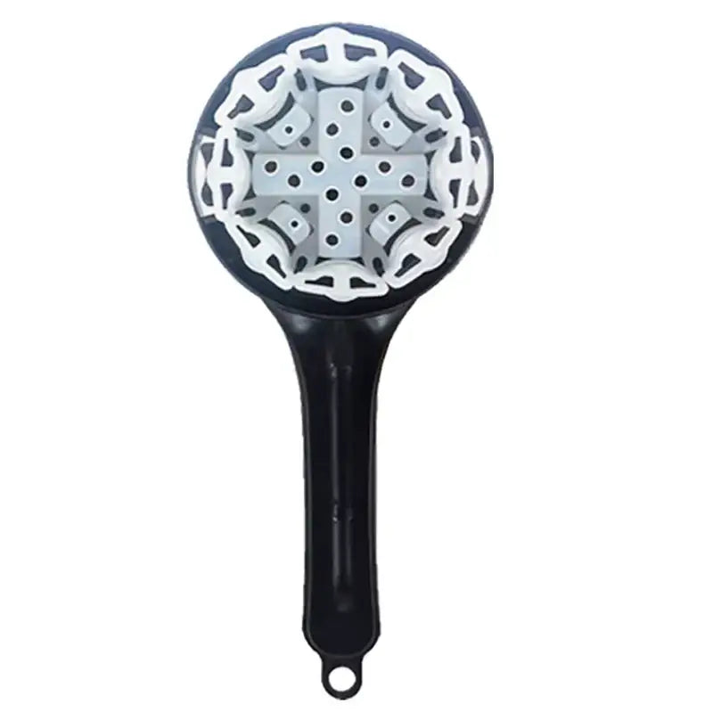 Black and white silicone brush cleaner with intricate cross pattern head for decorbites espresso machine use