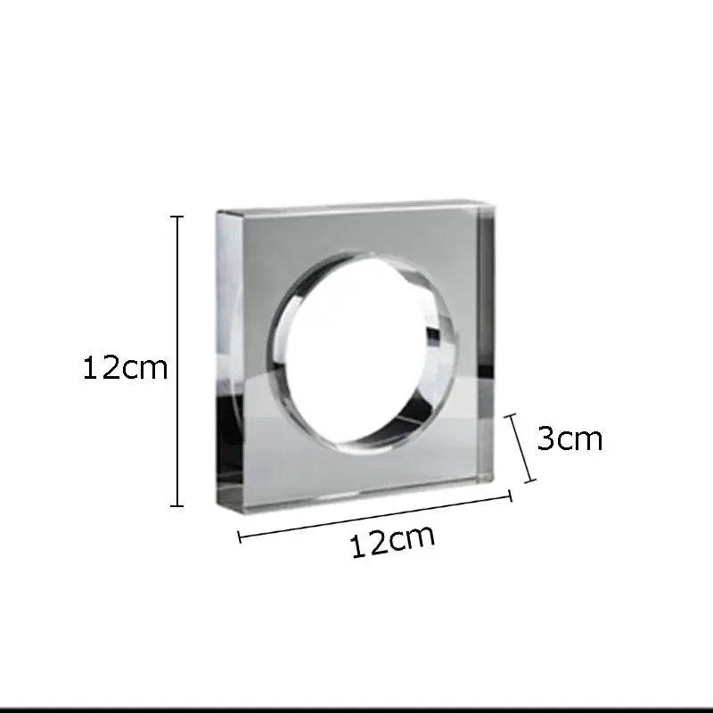 A sleek transparent acrylic square vase with polished chrome rim and circular opening for crystal arch glass decor