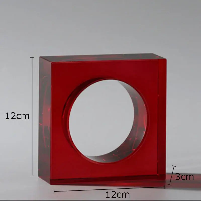 Red translucent acrylic square vase with central circular opening in a red and blue crystal arch glass sculpture decor