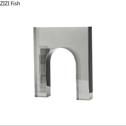 A sleek transparent acrylic crystal arch glass sculpture with polished silver finish and clean geometric lines for living room decor