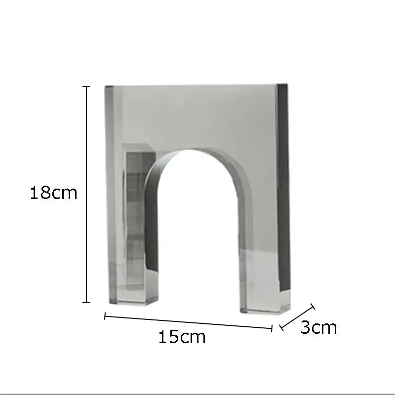 A sleek red and blue geometric crystal arch glass sculpture with polished silver finish for living room decor