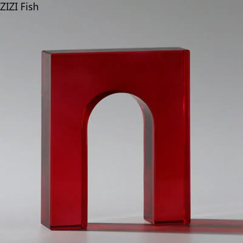 Red translucent acrylic crystal arch glass sculpture with smooth glossy finish and clean geometric lines for decor