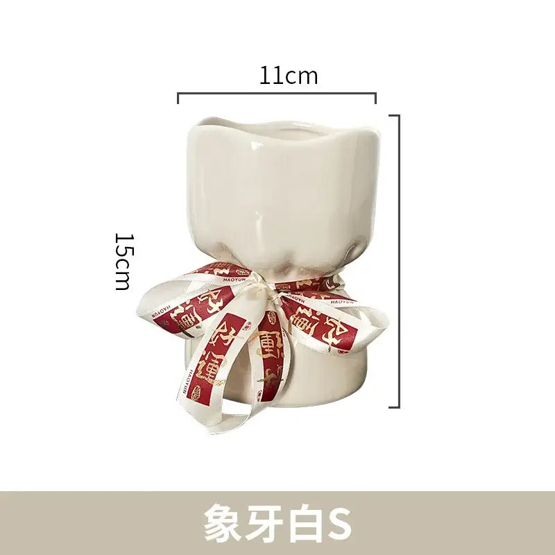 Cream-colored bouquet shape ceramic planter with red and white ribbon decorbites bouquet shape floral decor