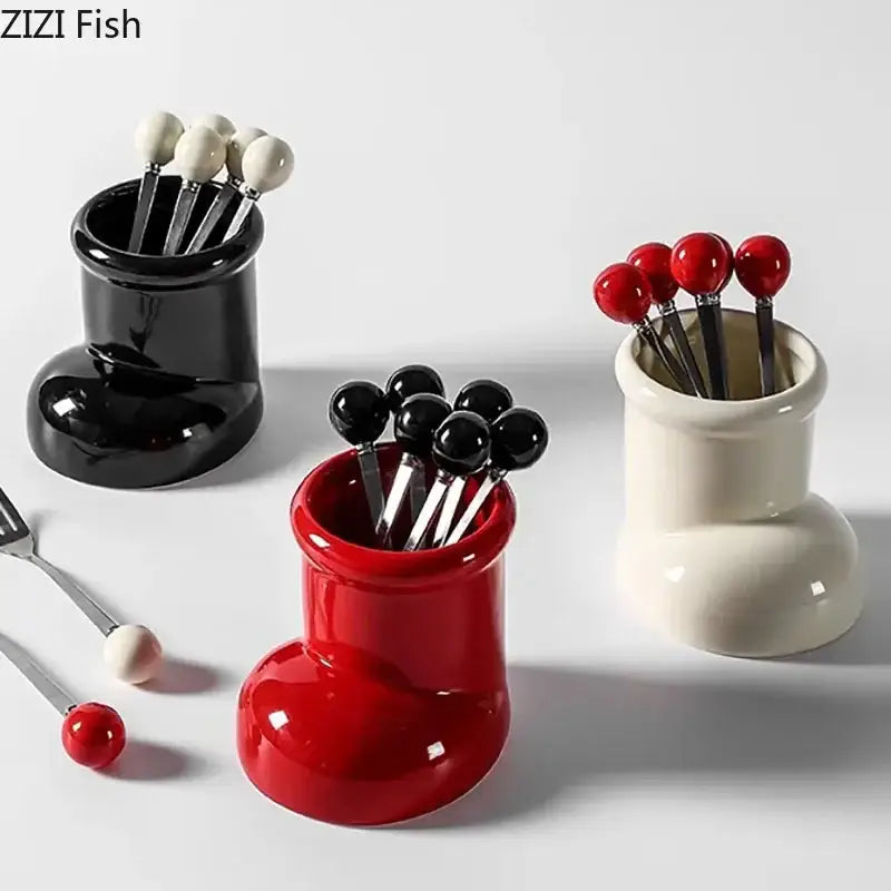 Red ceramic boot desk organizer box with glossy finish and black spherical tops for office and kitchen storage