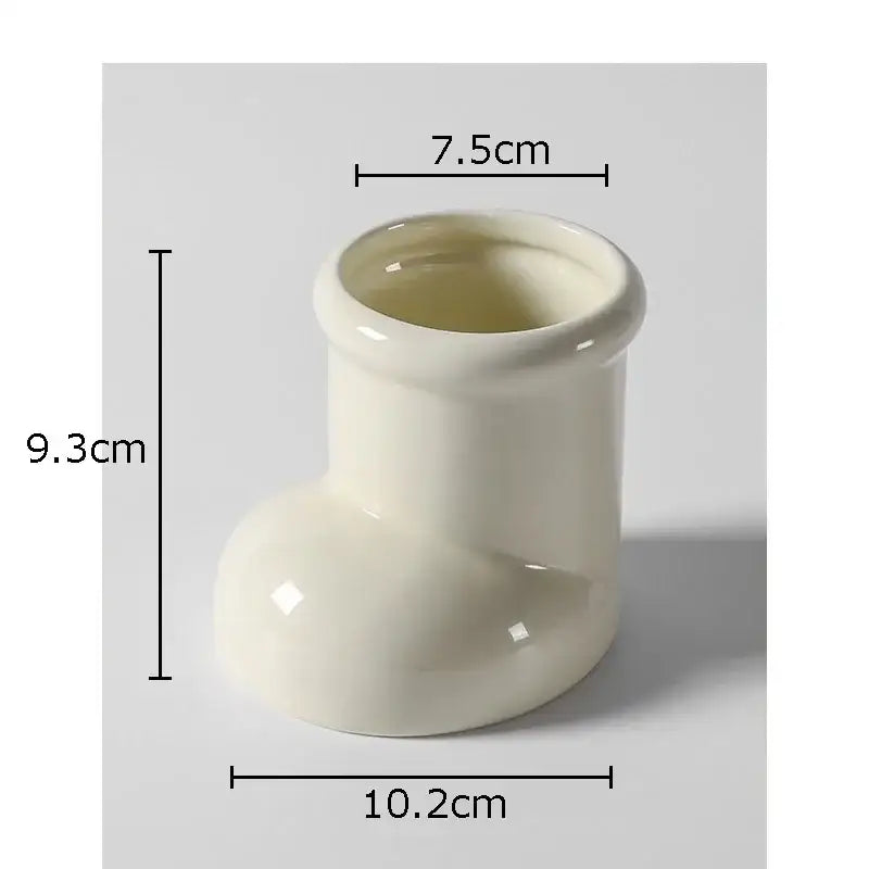 Cream-colored ceramic boot desk organizer box with glossy finish and minimalist design for office and kitchen storage