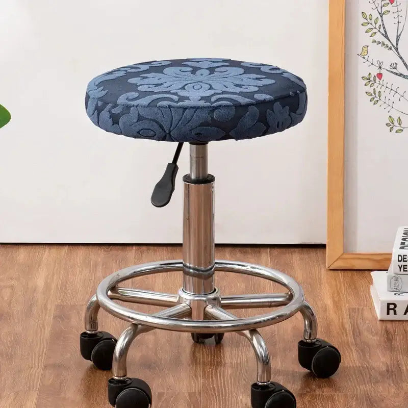 Blue floral patterned jacquard elastic bar chair cover with metallic base and casters by decorbites jacquard elastic
