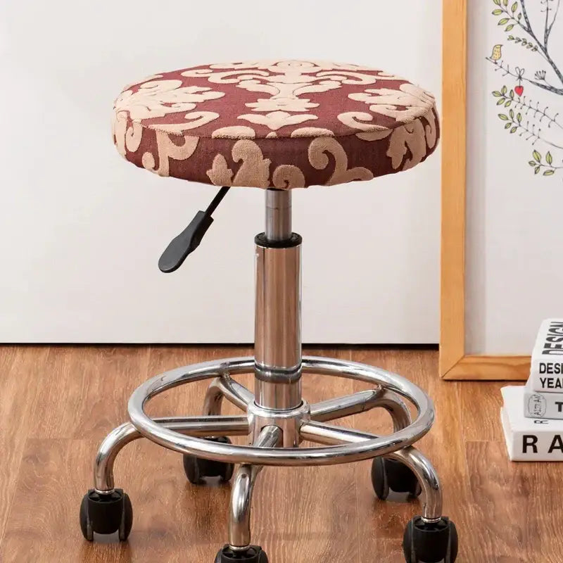 Maroon and beige patterned fabric stool with chrome base and adjustable height lever featuring decorbites jacquard elastic chair cover
