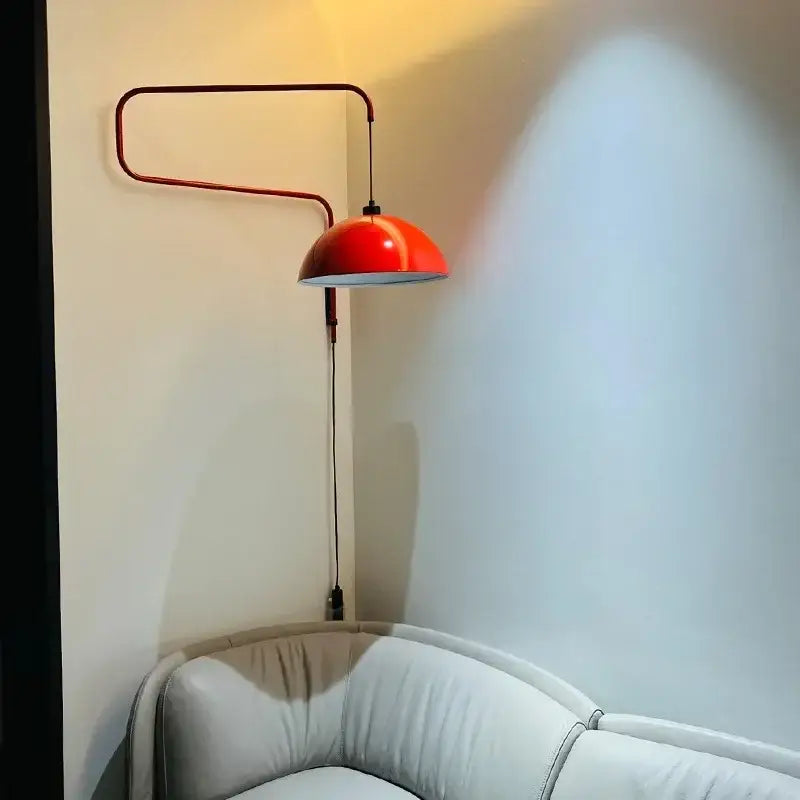 Vibrant red enamel dome adjustable pendant light with sleek curved metal arm for kitchen island decorbites pendant light