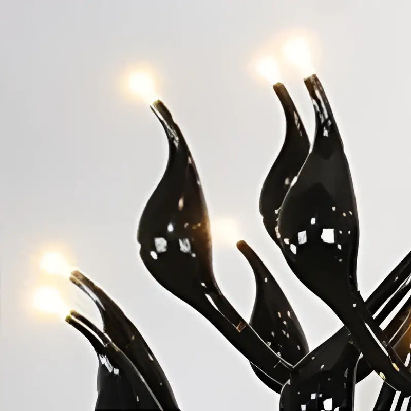 Black flame-shaped led string lights with glowing bulbs on a red glass iron swan pendant lamp living room chandelier