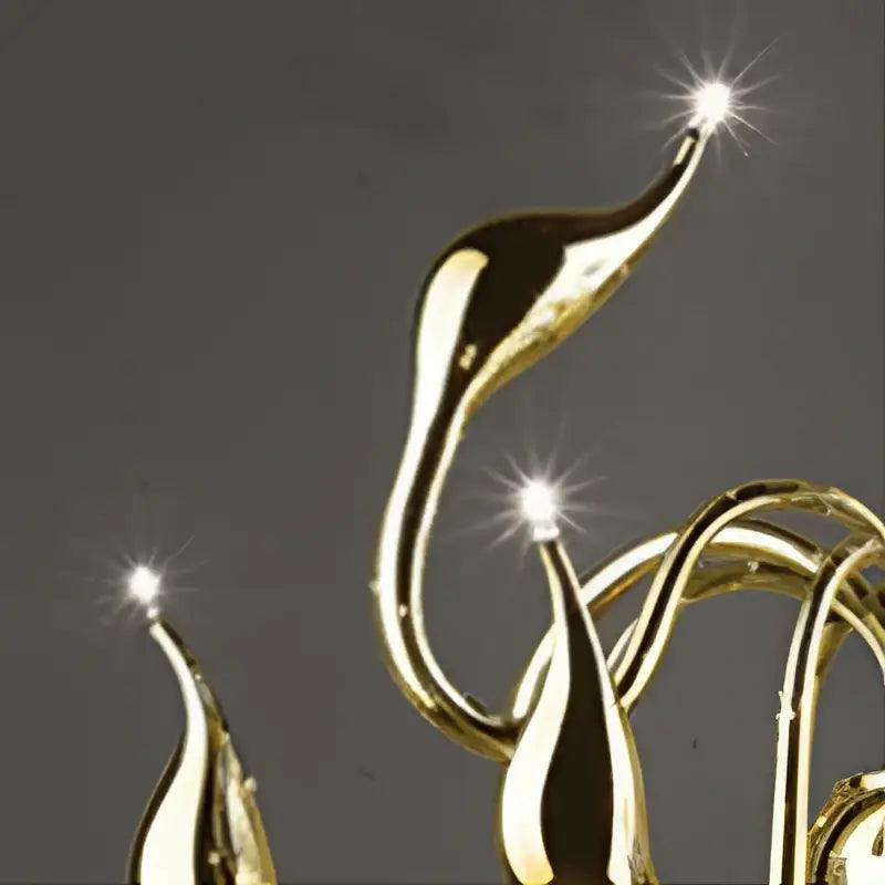Golden sleekly curved arms with polished metallic finish and bright lights on a red glass iron swan pendant lamp chandelier