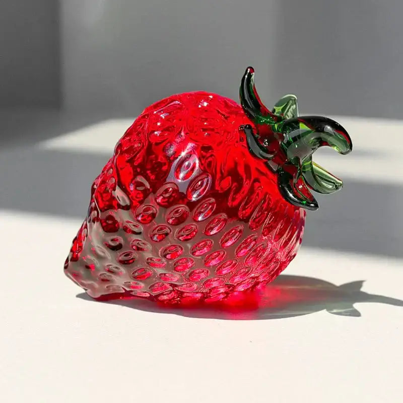 Vibrant red glass strawberry figurine with glossy finish and detailed seed texture for kitchen crystal fruit decor