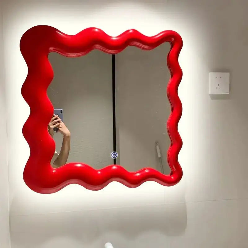 Red glossy cream cloud wave mirror with vibrant wavy edges for bedroom makeup decor by decorbites cream cloud