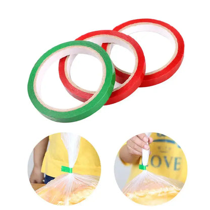 Red and green adhesive bag seal tape rolls designed for kitchen freshness sealing of plastic bags