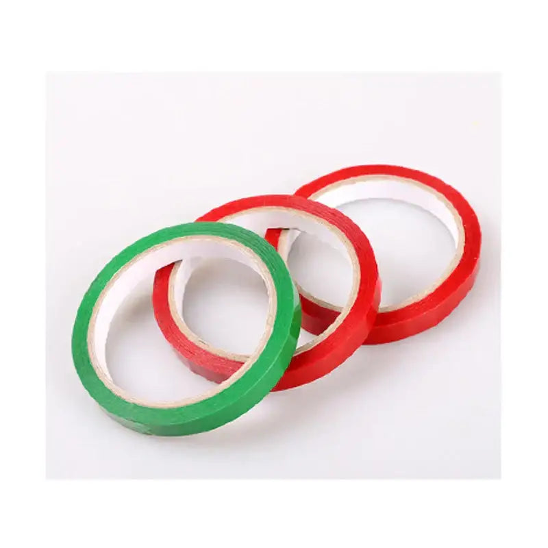 Red and green bag seal tape rolls with white cores for kitchen freshness sealing and bag sealing use
