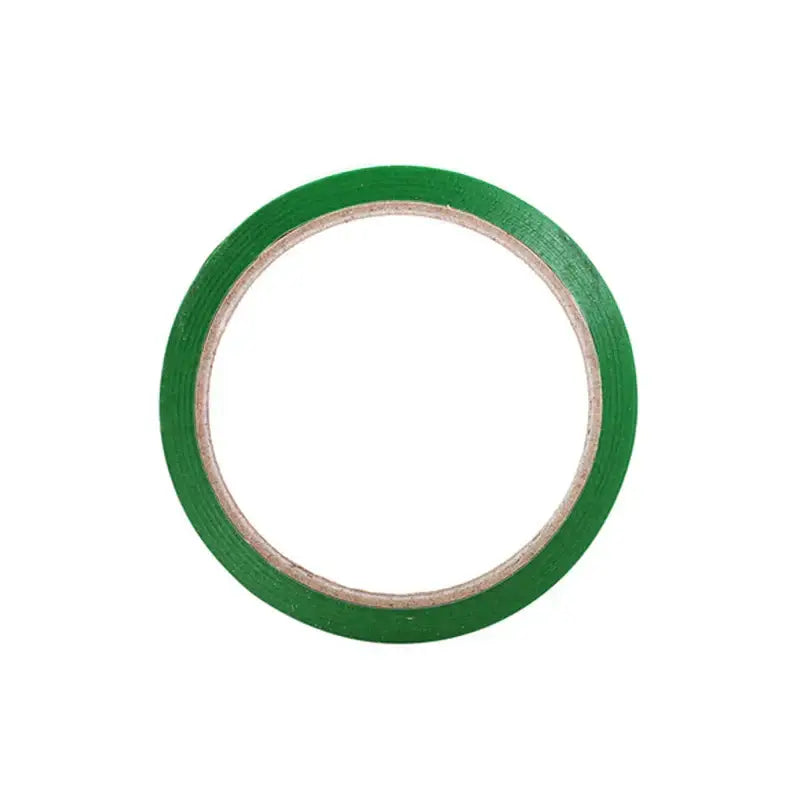 A roll of vibrant green bag seal tape with a matte finish wound around a light brown cardboard core for kitchen use