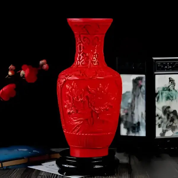 Red lacquerware flower auspicious vase with intricate dragon and floral carvings in glossy red ceramic finish