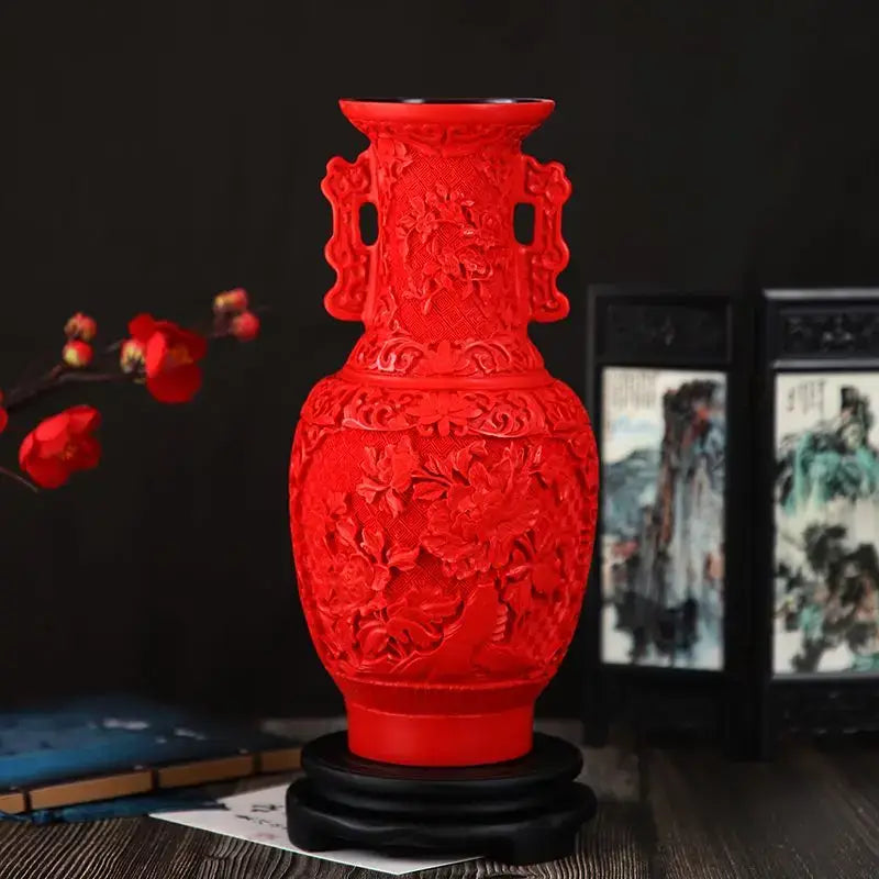 Vibrant red lacquerware flower auspicious vase with intricate dragon carving and ornate handles on black wooden base