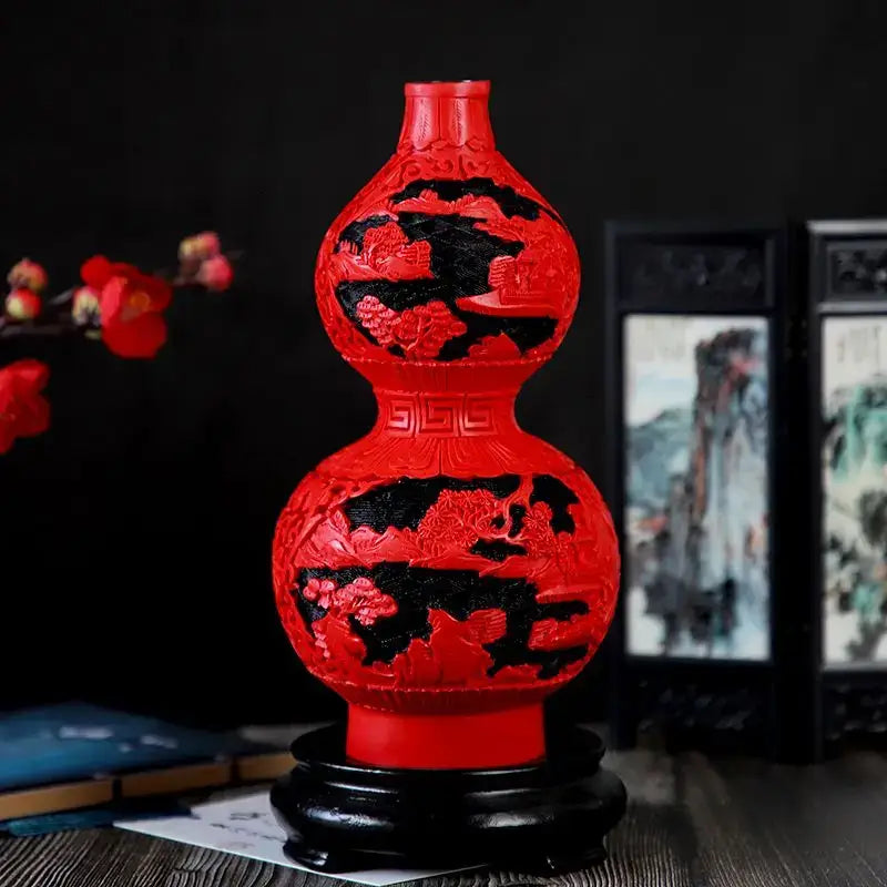 Vibrant red lacquerware flower auspicious vase carved with dragon and floral patterns on a dark wooden base