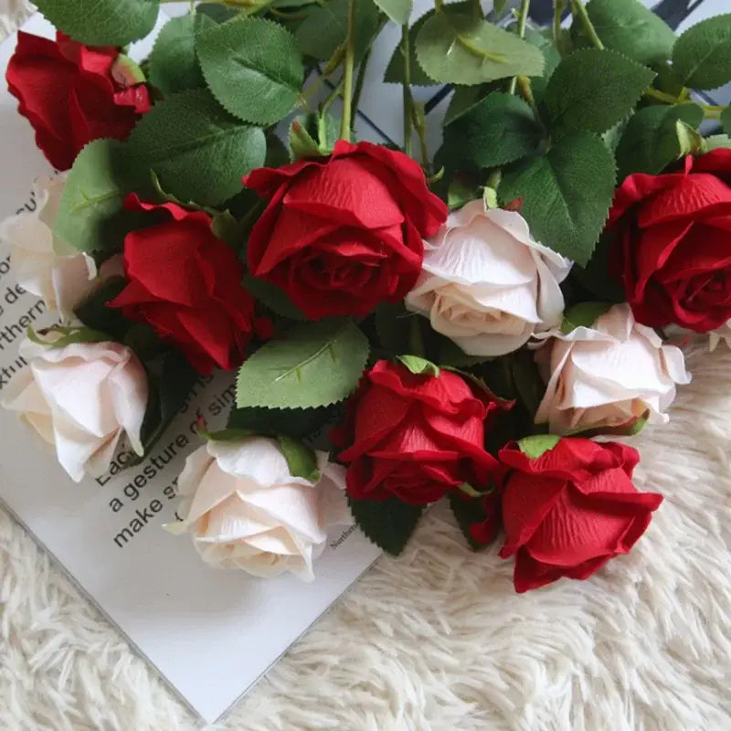 A bouquet of red pink and cream dried roses artificial flowers made from fabric for wedding decor by decorbites dried roses
