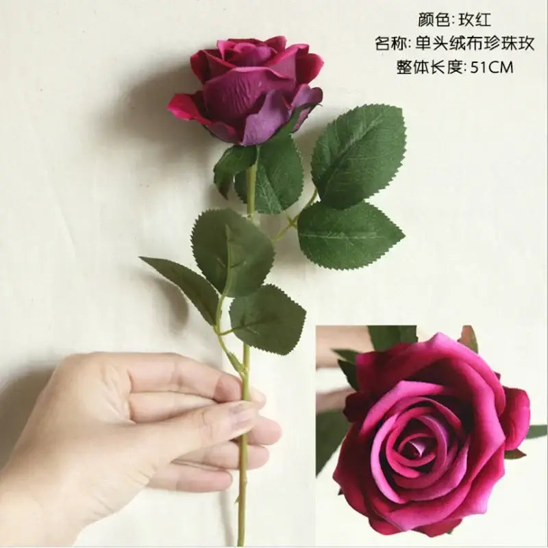 A single-stem decorbites dried roses artificial fabric rose with deep burgundy petals and green leaves for wedding decor