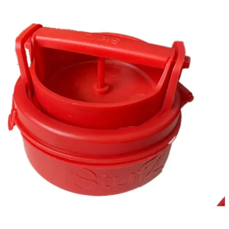 Red plastic hamburger meat presser with handle and embossed stufz branding for filling maker use