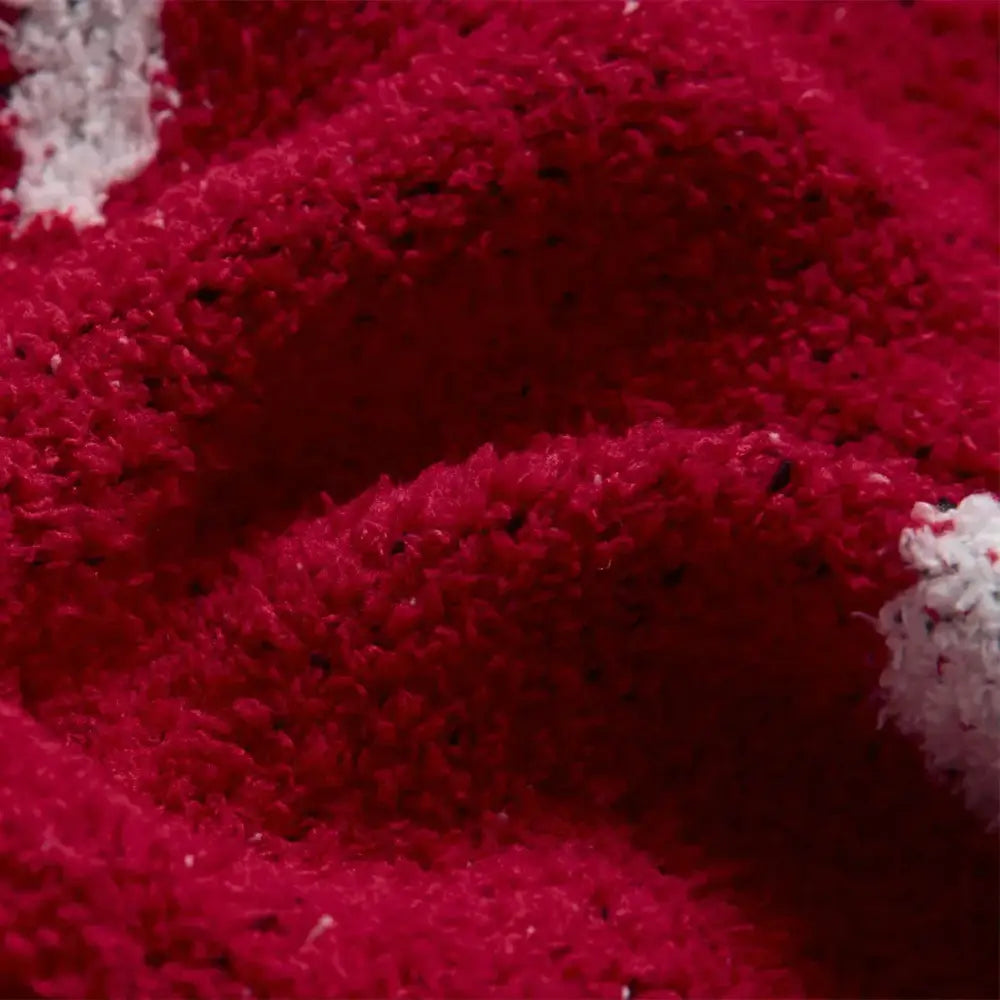 A plush deep red knitted throw blanket with soft texture and subtle white accents for decorbites lively rabbit decorbites lively