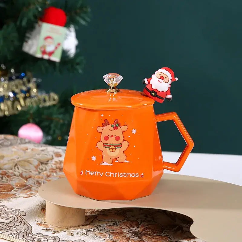 Bright orange ceramic christmas mug set with geometric design, cartoon reindeer, crystal knob lid, and santa figurine