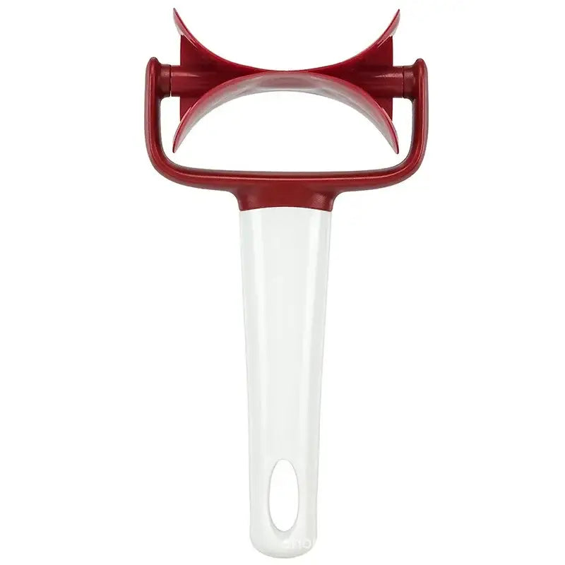 Red and white plastic vegetable peeler with curved ergonomic handle ideal for use as a dough press cutter tool