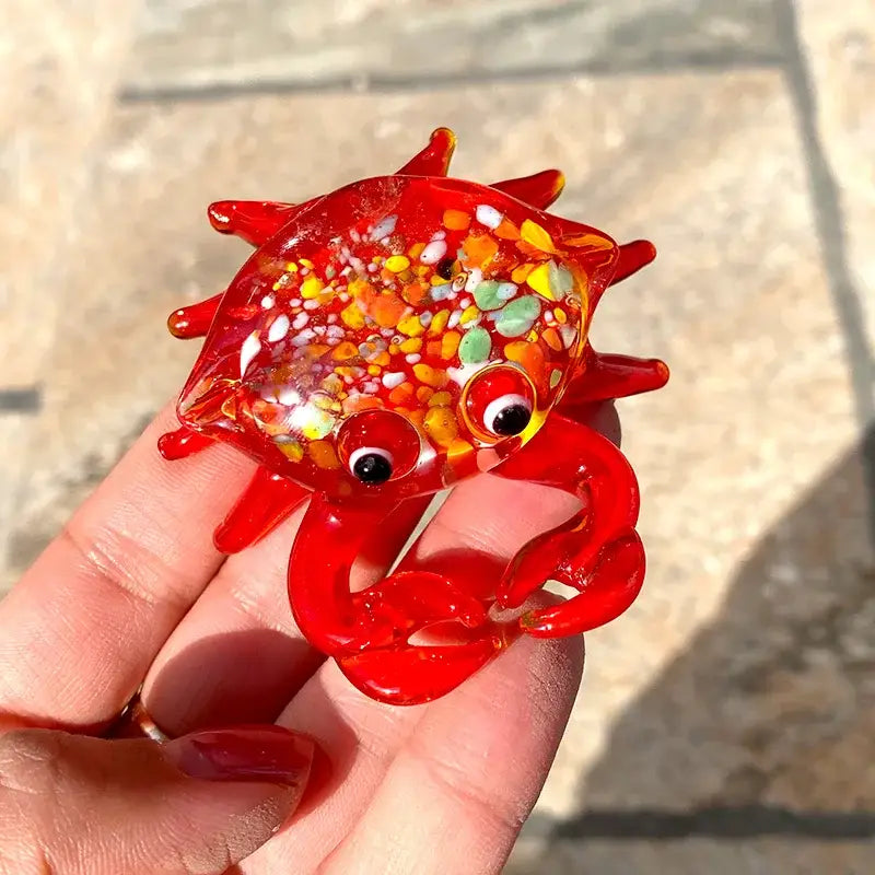 A vibrant red decorbites crab glass figurine with translucent body and colorful beads for living room art sculpture