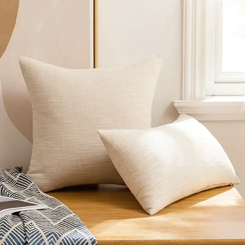 Beige linen throw pillow with subtle woven pattern included in red textured linen pillow covers set for living room decorbites