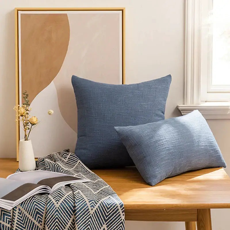 Two blue linen throw pillows with subtle textured weave in a red textured linen throw pillow covers set for living room decorbites linen throw pillow covers